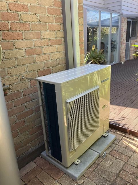 A new outdoor unit on concrete pads