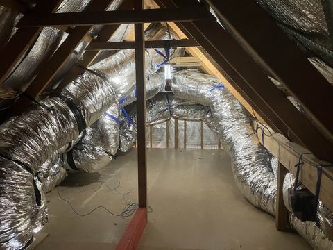 New insulated ducts run through a roof space