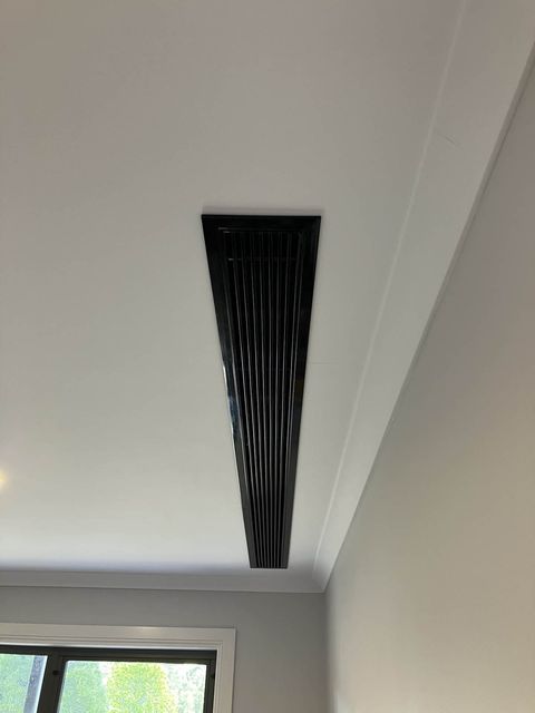 A linear slot diffuser in a ceiling, for ducted air