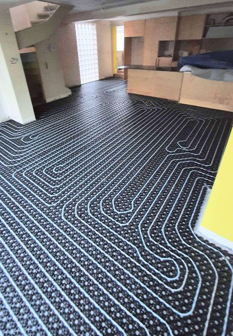 Underfloor heating pipe laid on insulation panels